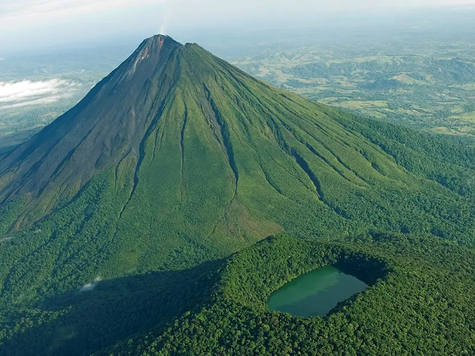 Arenal Volcano rising above the national park forest, Costa Rica