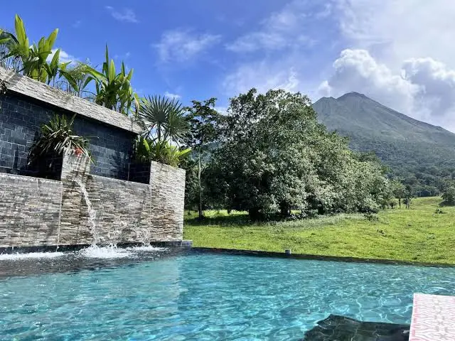 Geothermal hot spring pool surrounded by tropical gardens in La Fortuna